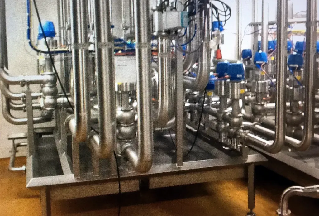 TIG-welded stainless process pipework on a pipe rack